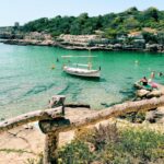 white and black boat on sea during daytime